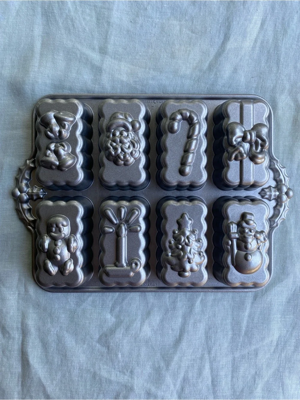 Nordic Ware 6 cup holiday mini loaf cake pan Christmas Santa candy cane present